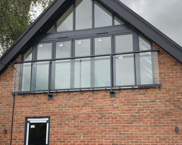 Aerofoil Balconnette Juliet balcony — wing-shaped handrail, wide span