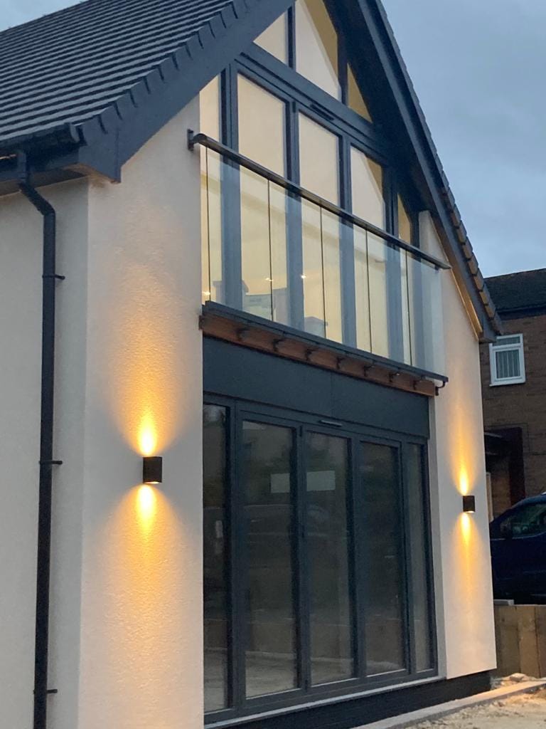 Balconnette glass Juliet balcony fitted to French doors on upper floor