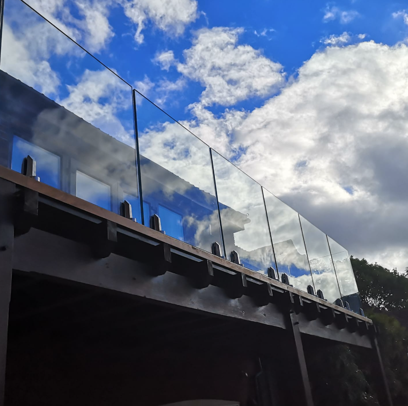Frameless spigot glass balcony on a raised terrace