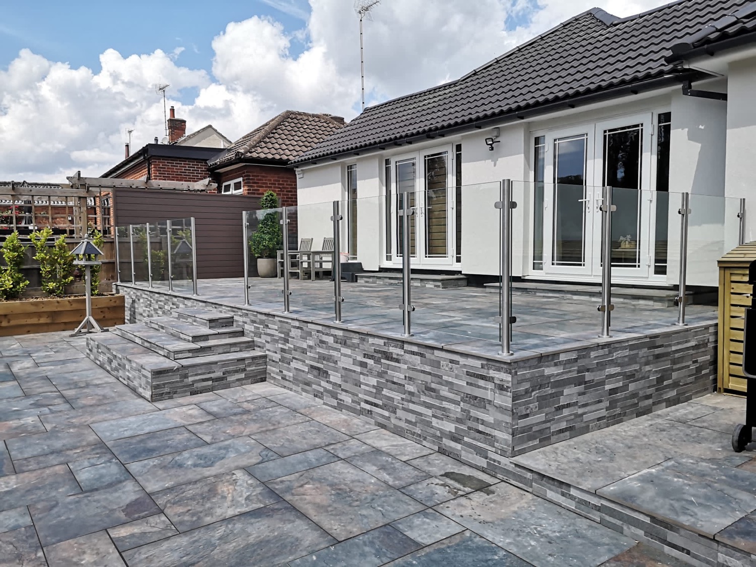 Semi-frameless glass balustrade with slim stainless posts