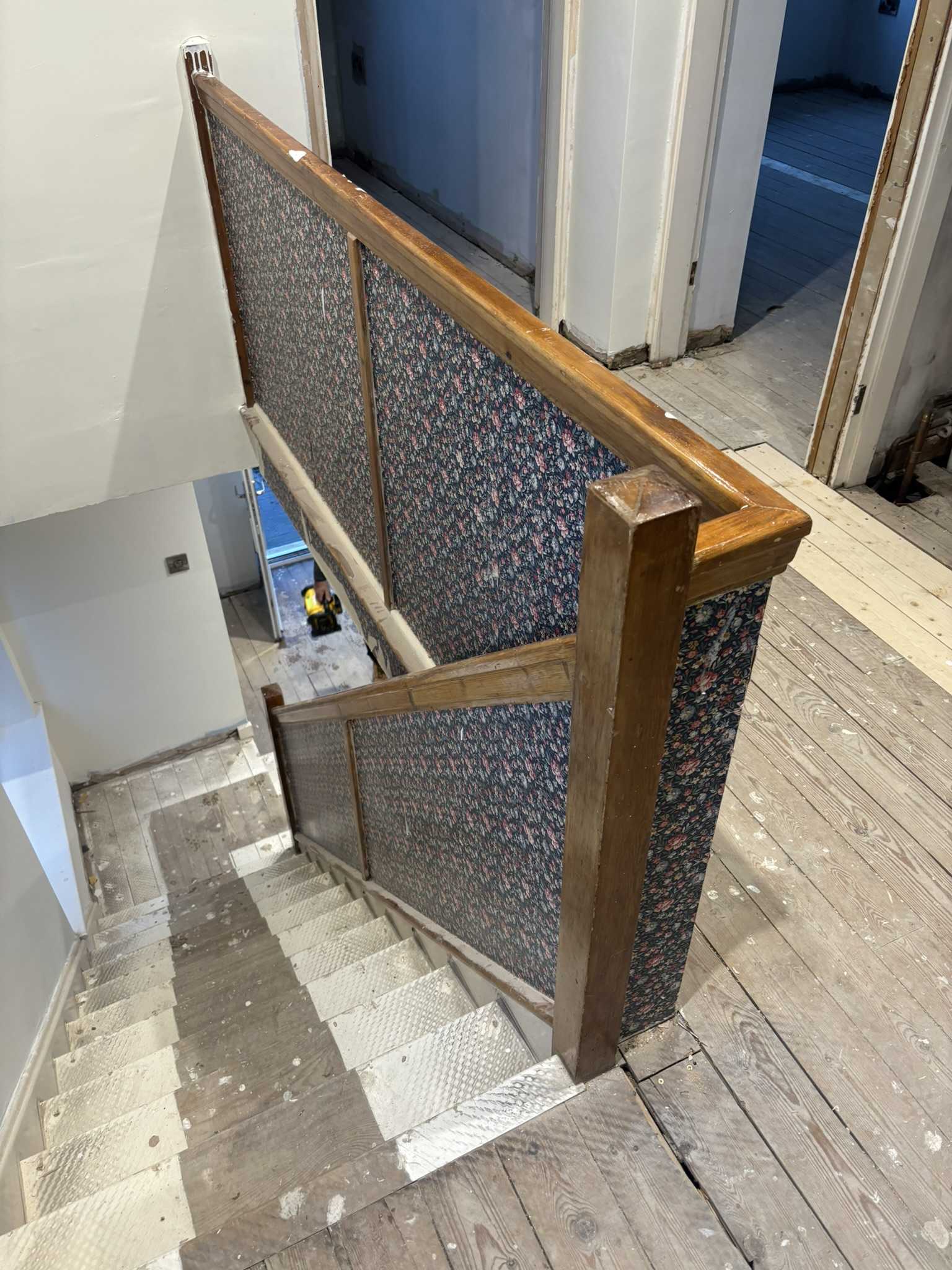 Before staircase renovation — original spindles