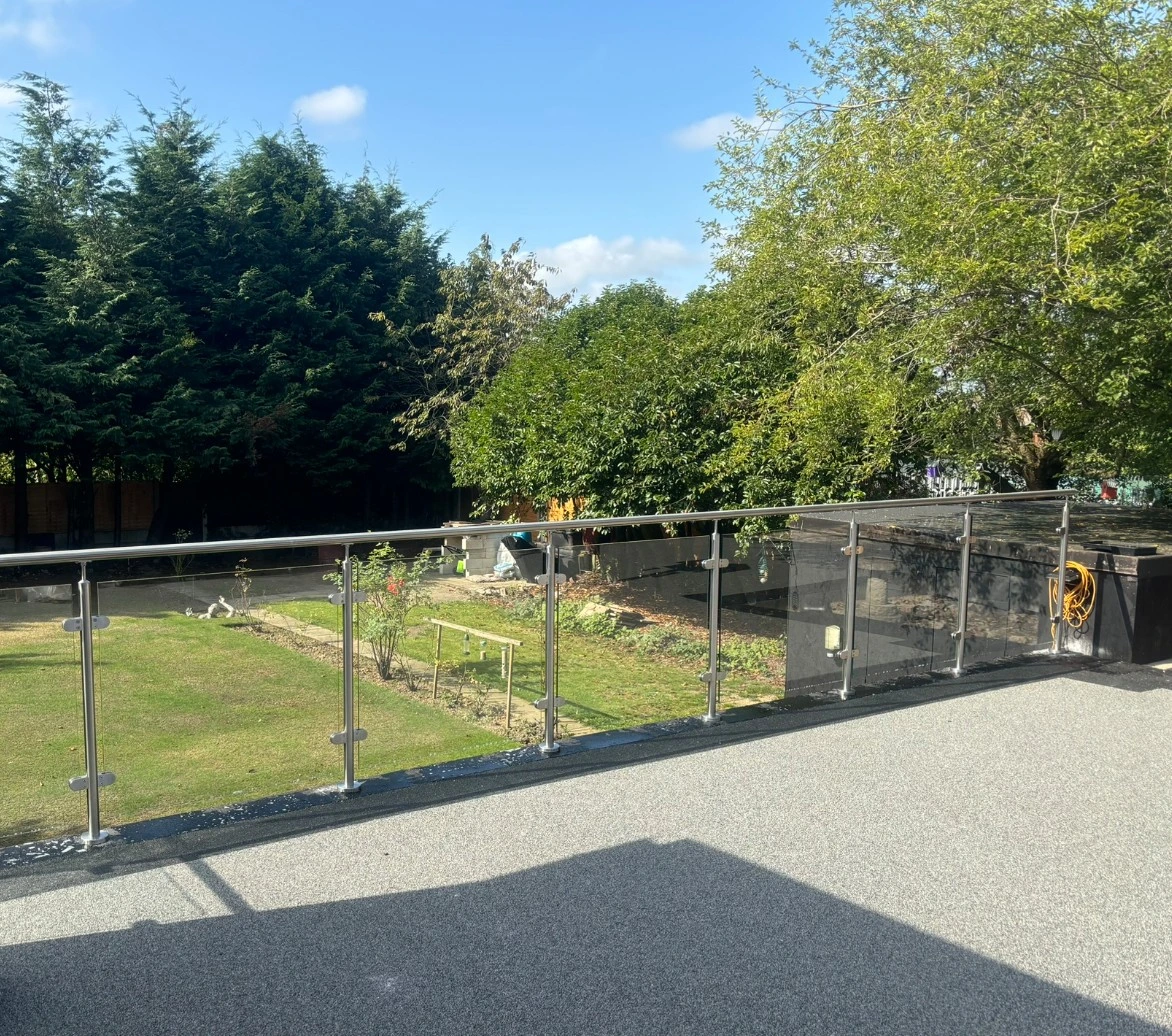 Glass balustrade installation on residential staircase and balcony