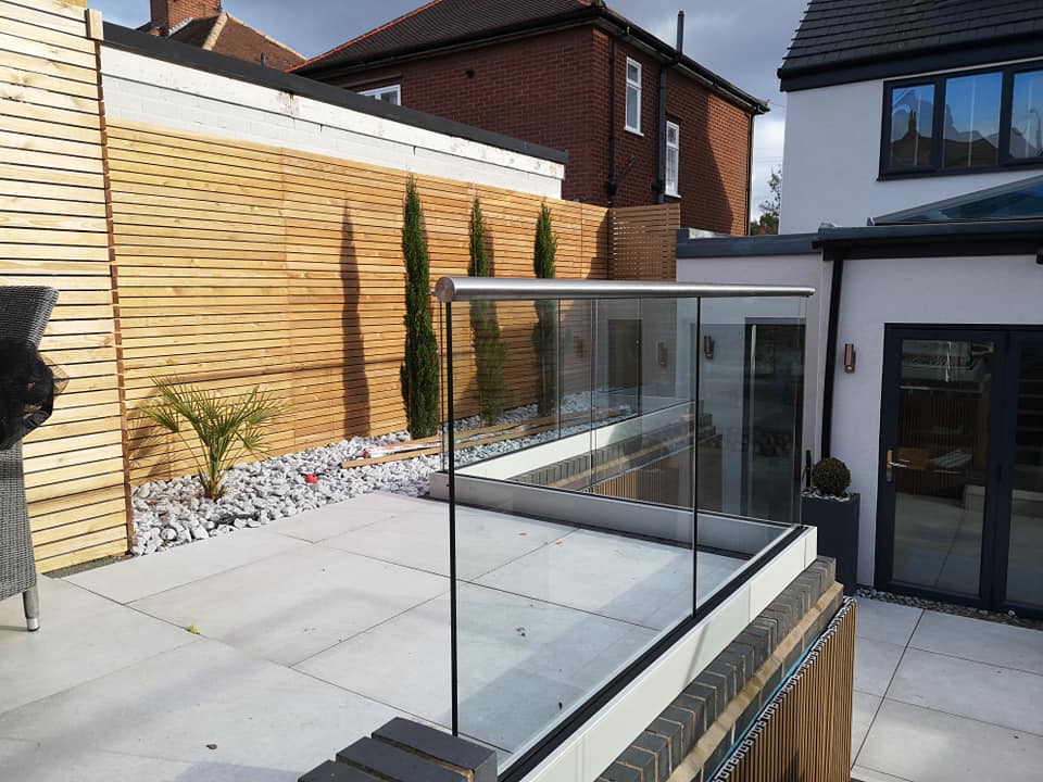 Frameless channel glass balustrade installed in garden