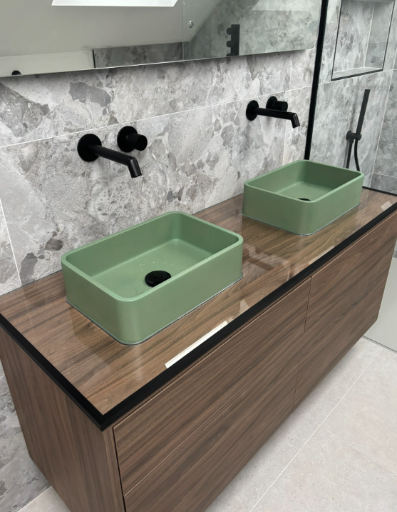 Glass splashback behind bathroom basin