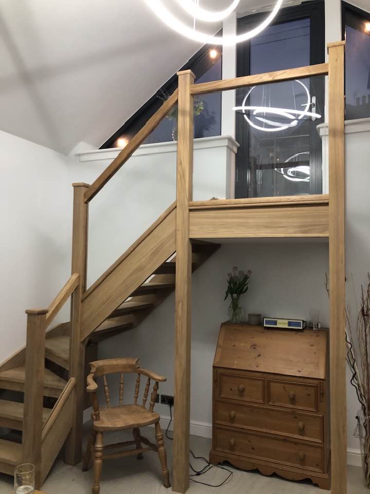 All oak staircase with glass panel balustrade