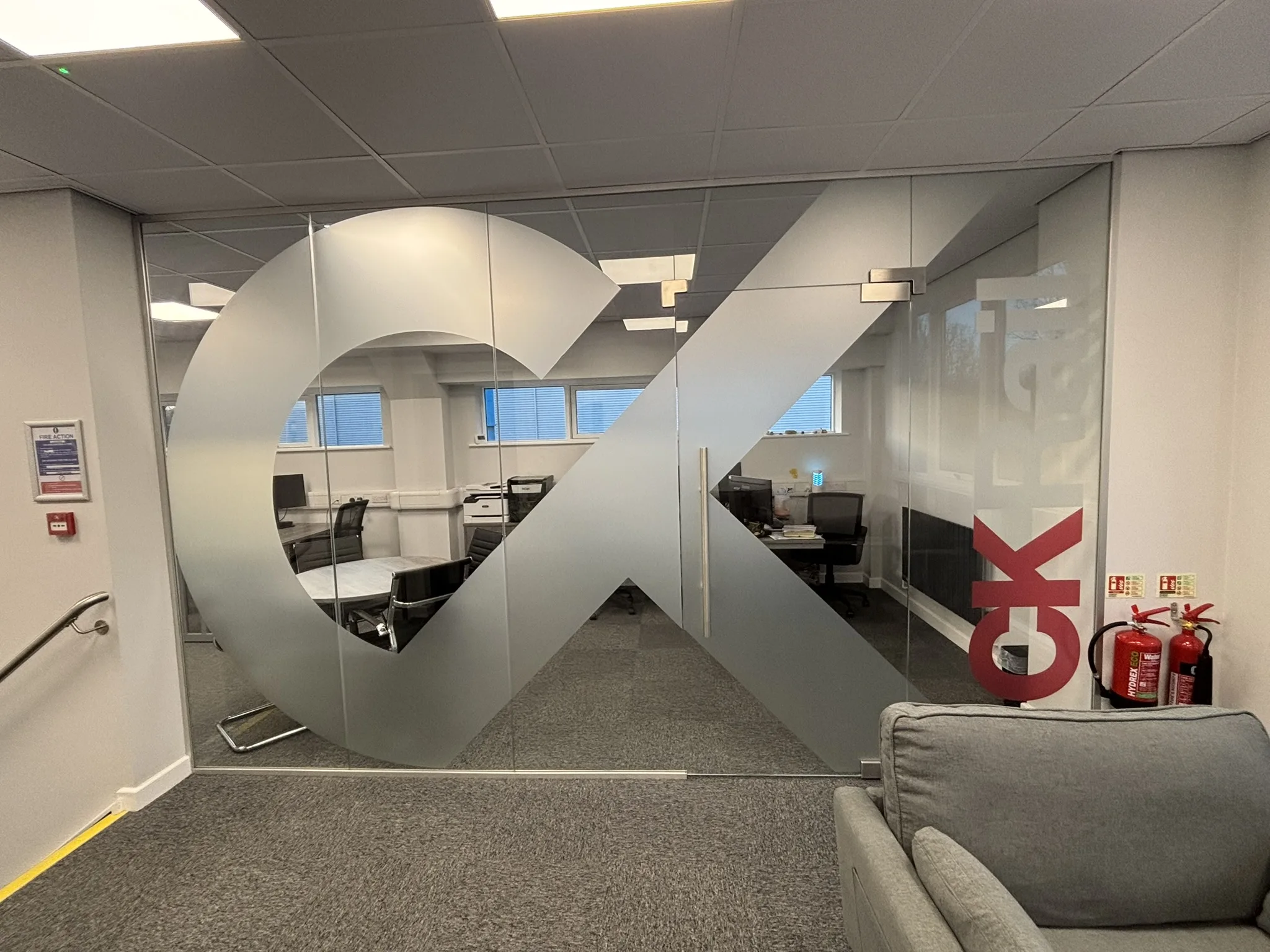 Aluminium glass partition in a Chesterfield office for CK Rail with toughened glass.