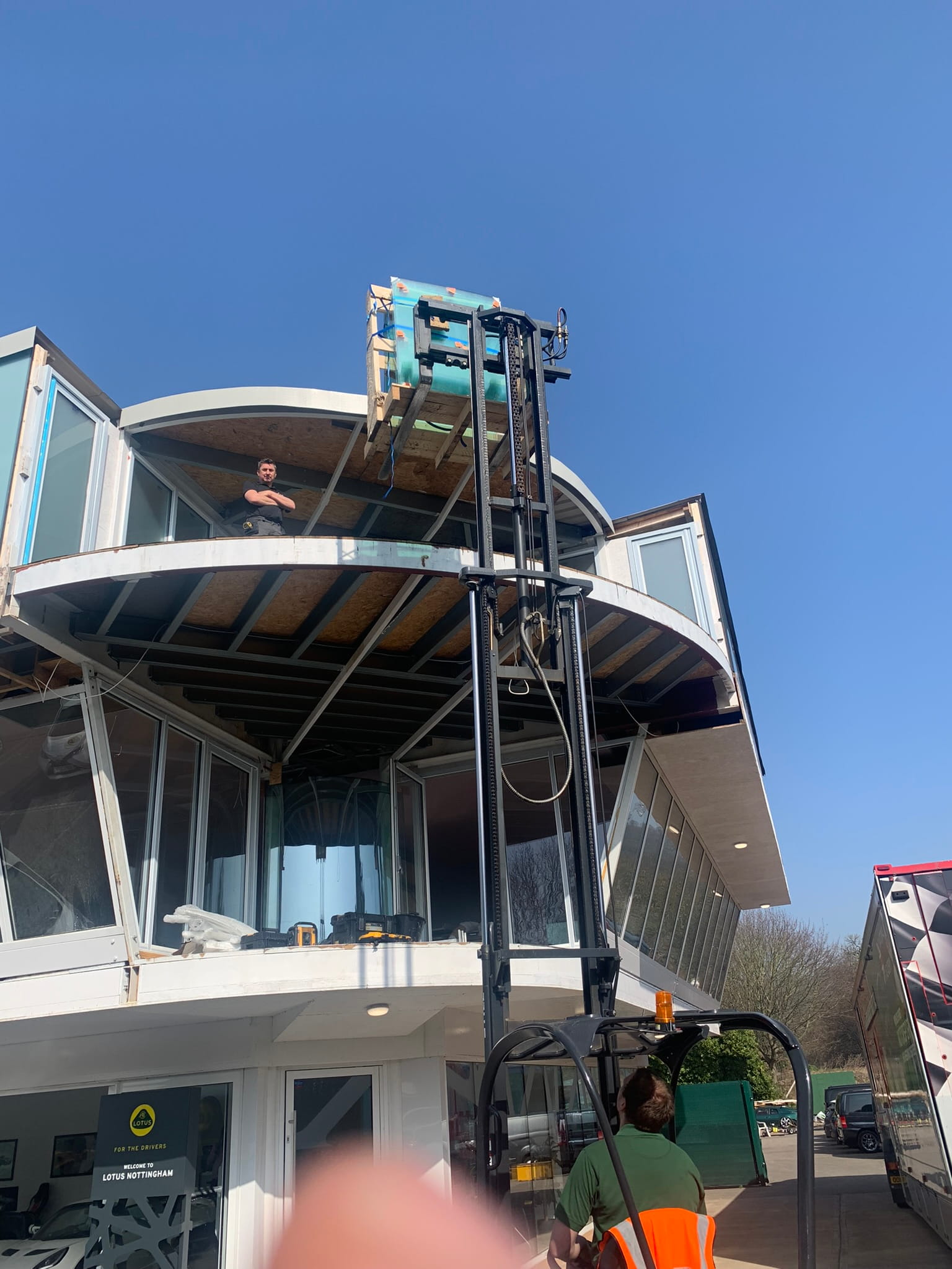 Balconnette Aerofoil curved glass balustrade installed at Lotus dealership, West Bridgford