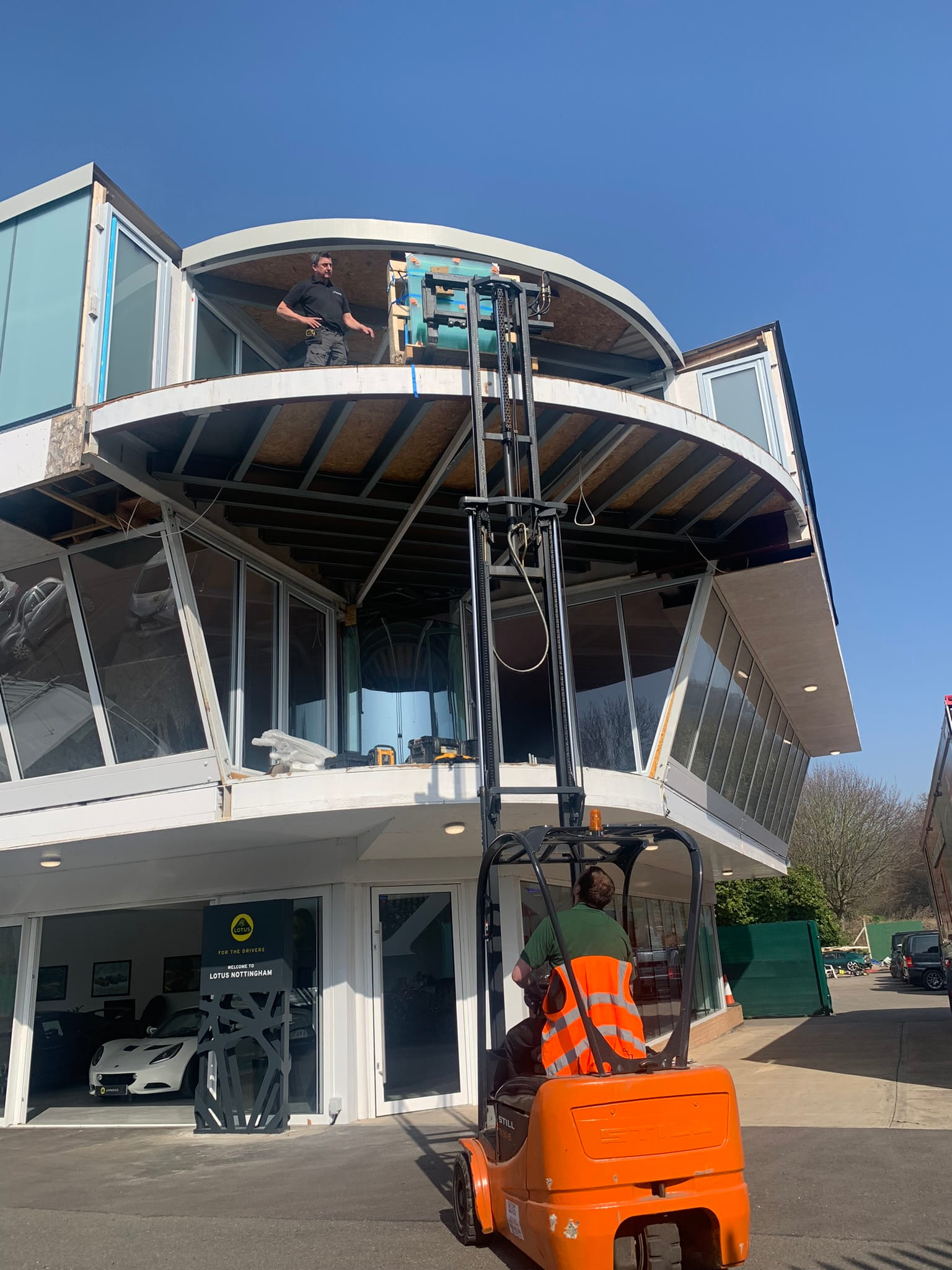 Curved Balconnette Aerofoil balustrade system in Lotus car showroom, West Bridgford