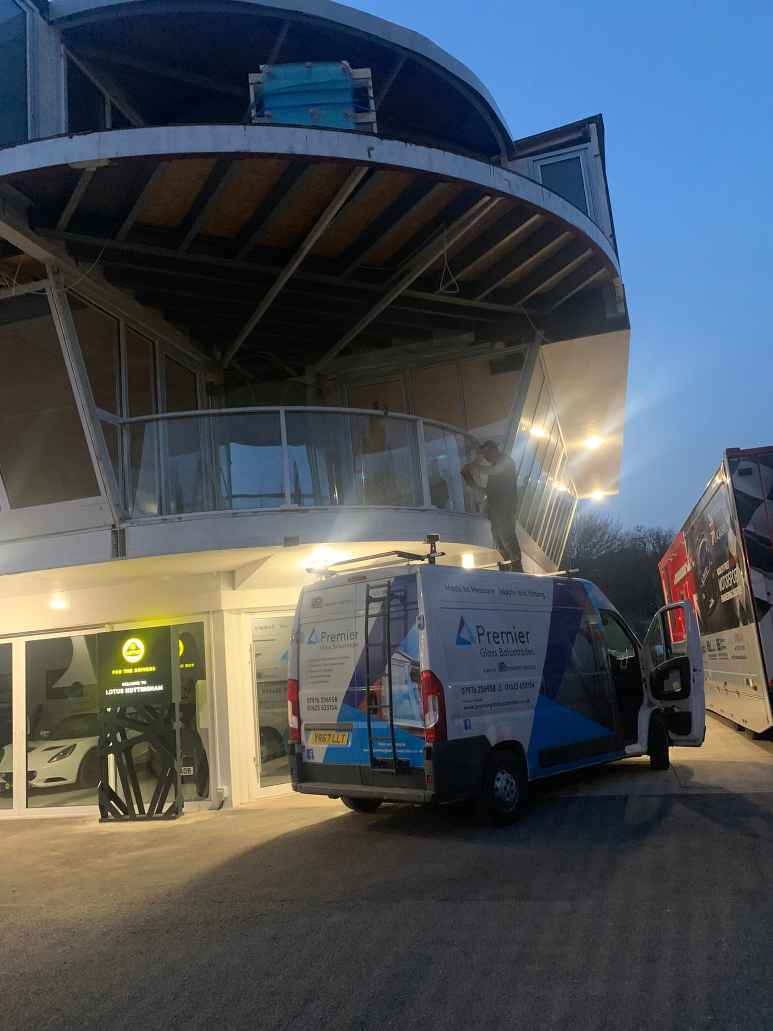 Balconnette Aerofoil handrail bent to bespoke radius on curved balcony at Lotus garage