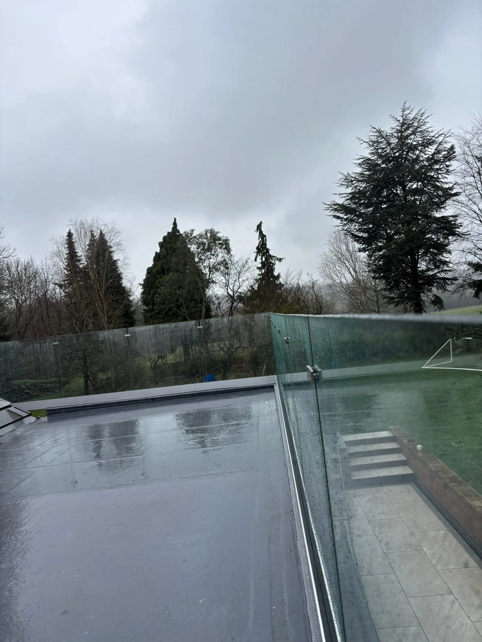 Corner angle view of frameless channel balustrade on Doncaster roof terrace