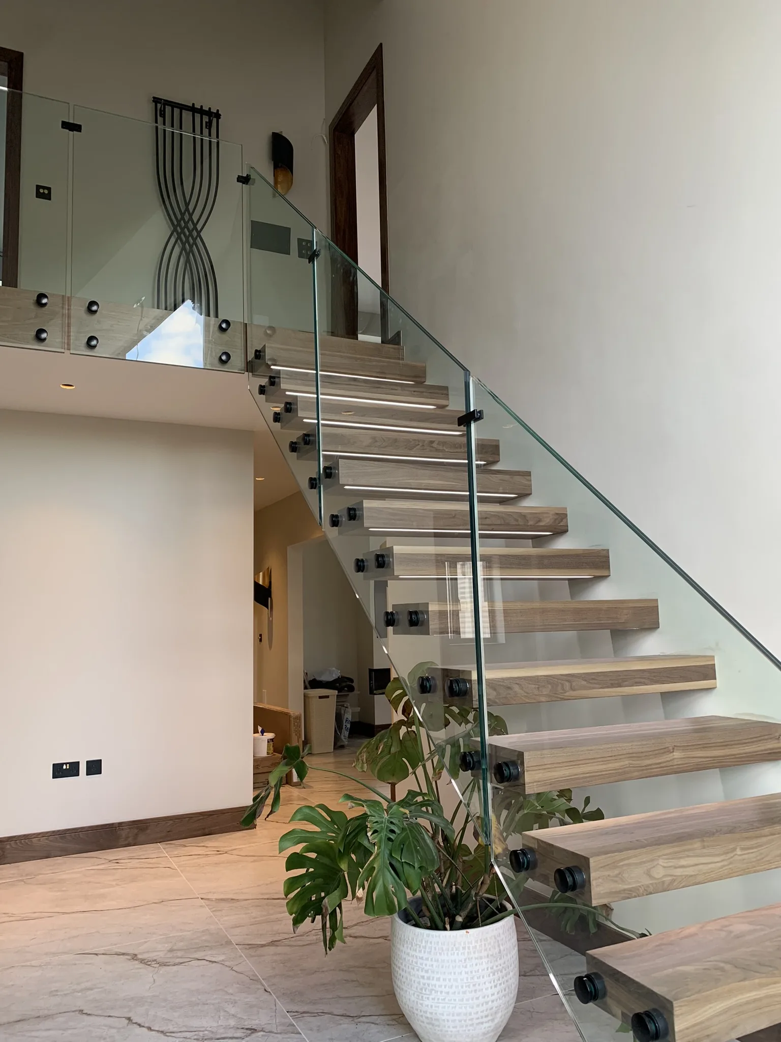 floating staircase with toughened laminated glass balustrade