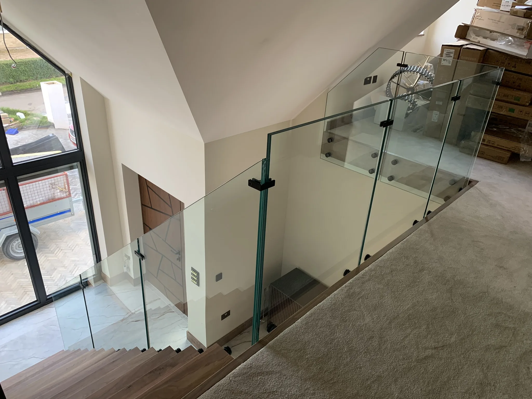 Contemporary walnut cantilever staircase installation in Lincoln home
