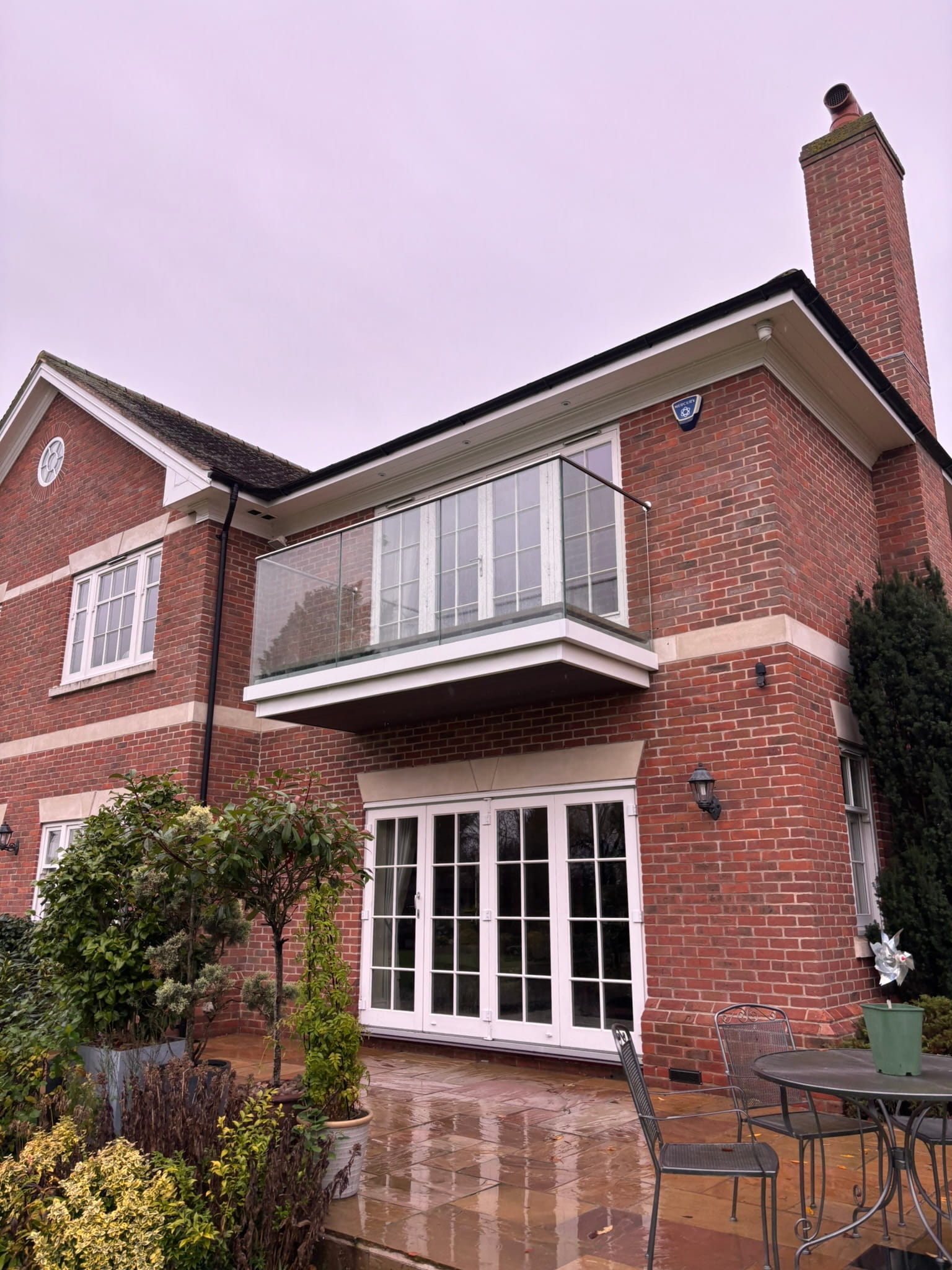 Toughened laminated glass panels in aluminium base channel, balcony renovation Nottingham