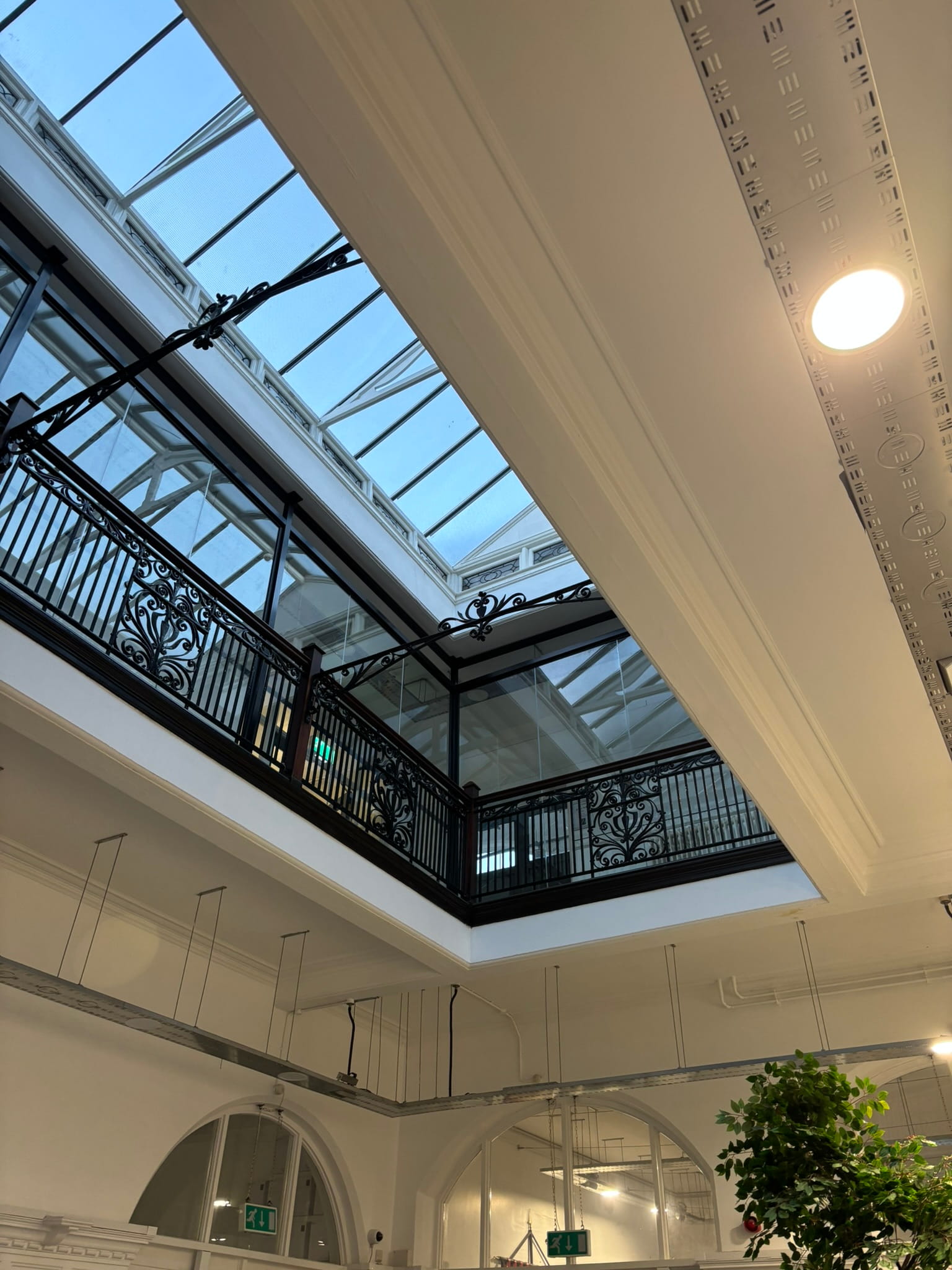Glass safety barrier fixing detail — sympathetic fixings into existing balustrade structure, Burslem School of Art