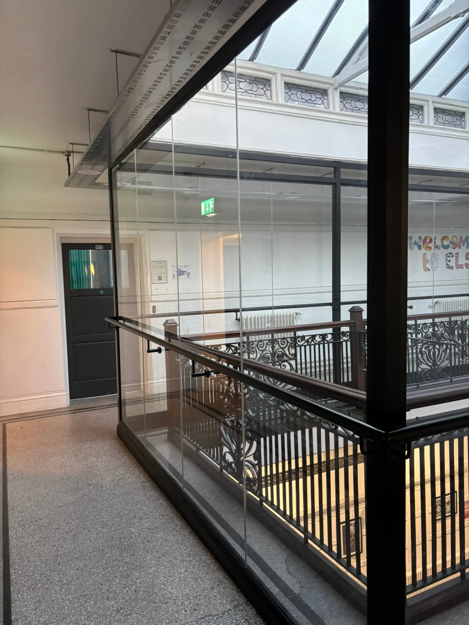 Heritage building balustrade upgraded with modern glass safety system