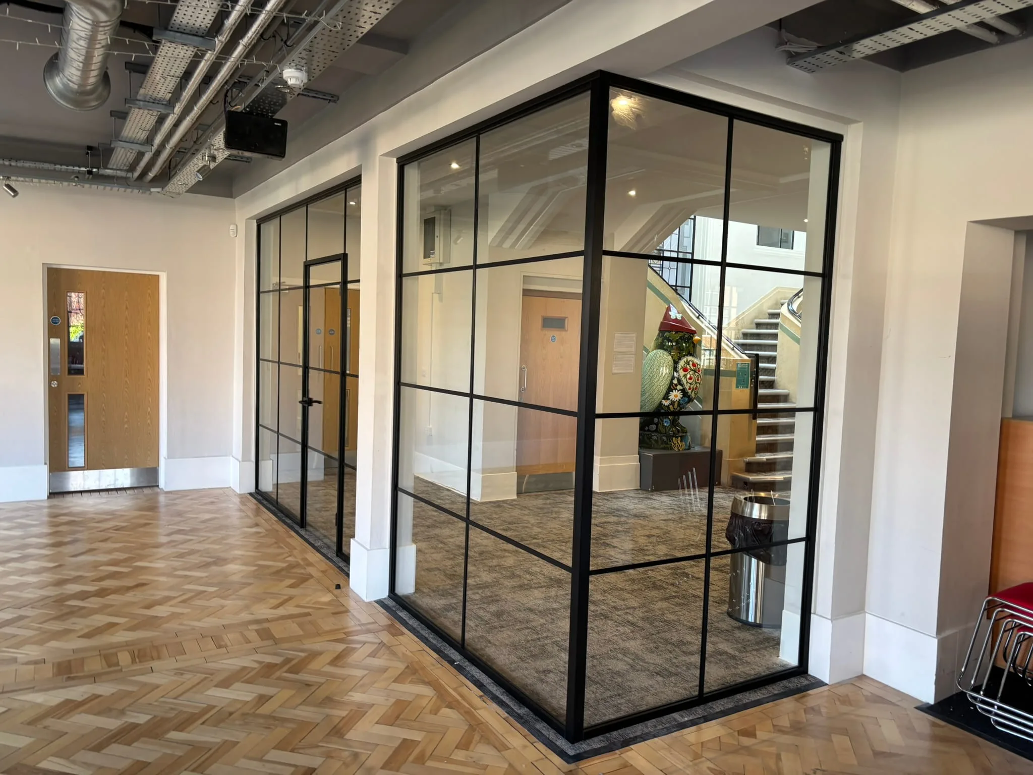Glass partitioning installation in Beeston Nottingham with black aluminium frame