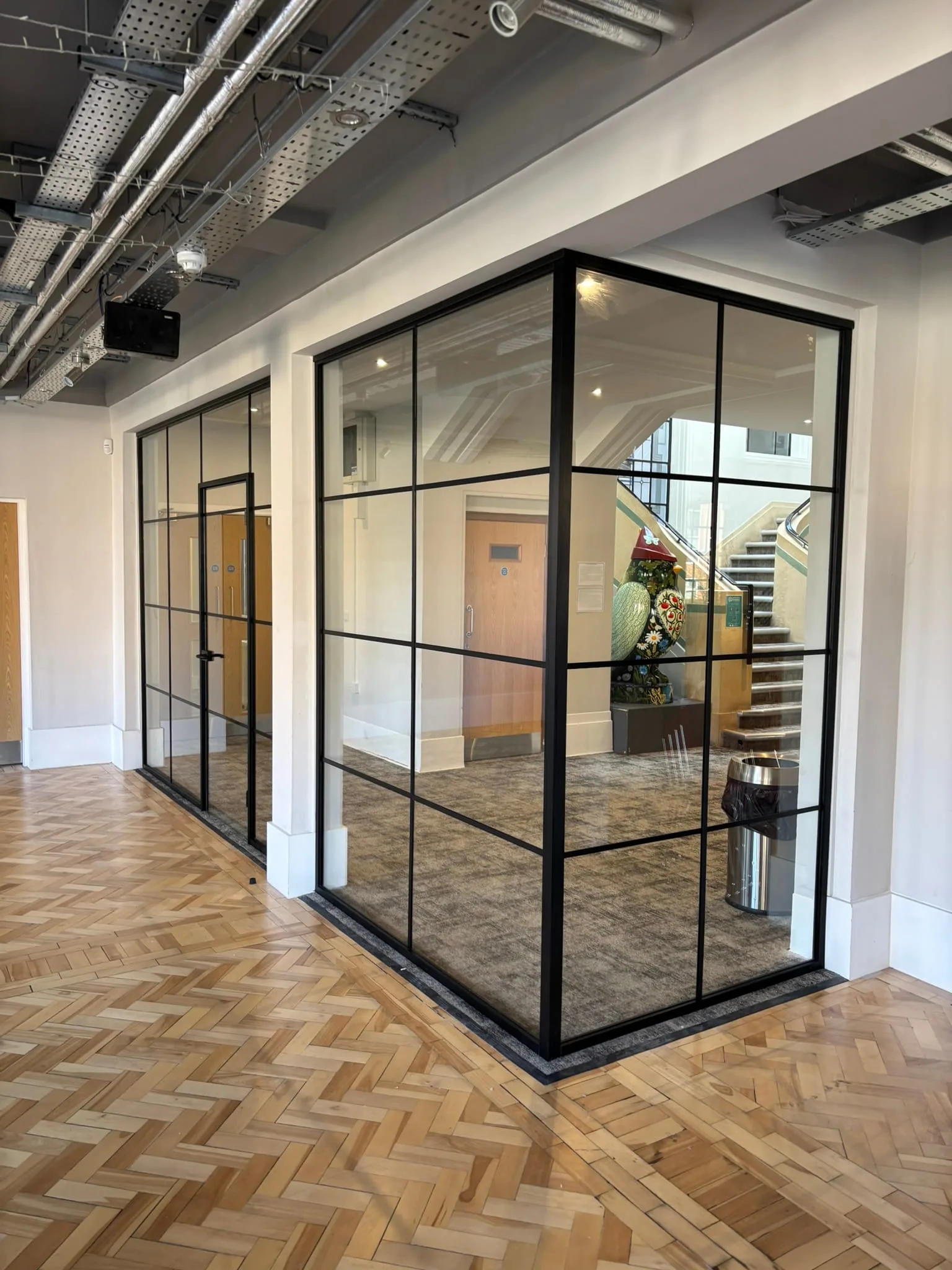Office glass walls with black crittall style bars Nottingham