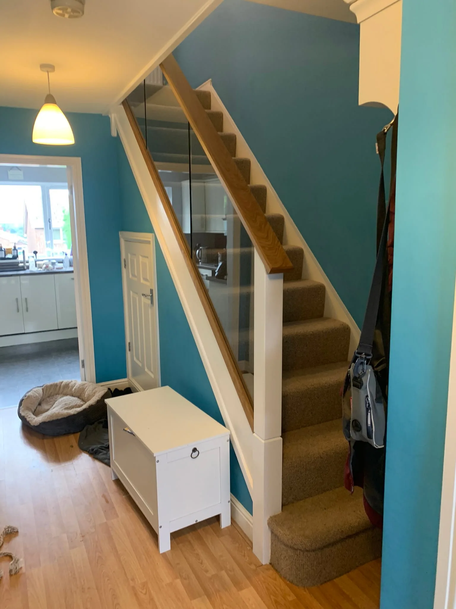 Oak newel cap and white square post detail on completed staircase renovation, Derby