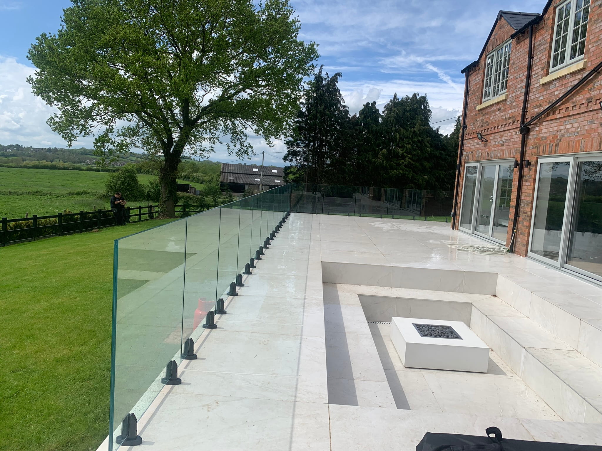 Frameless glass balustrade panels with minimal visible fixings, Worksop