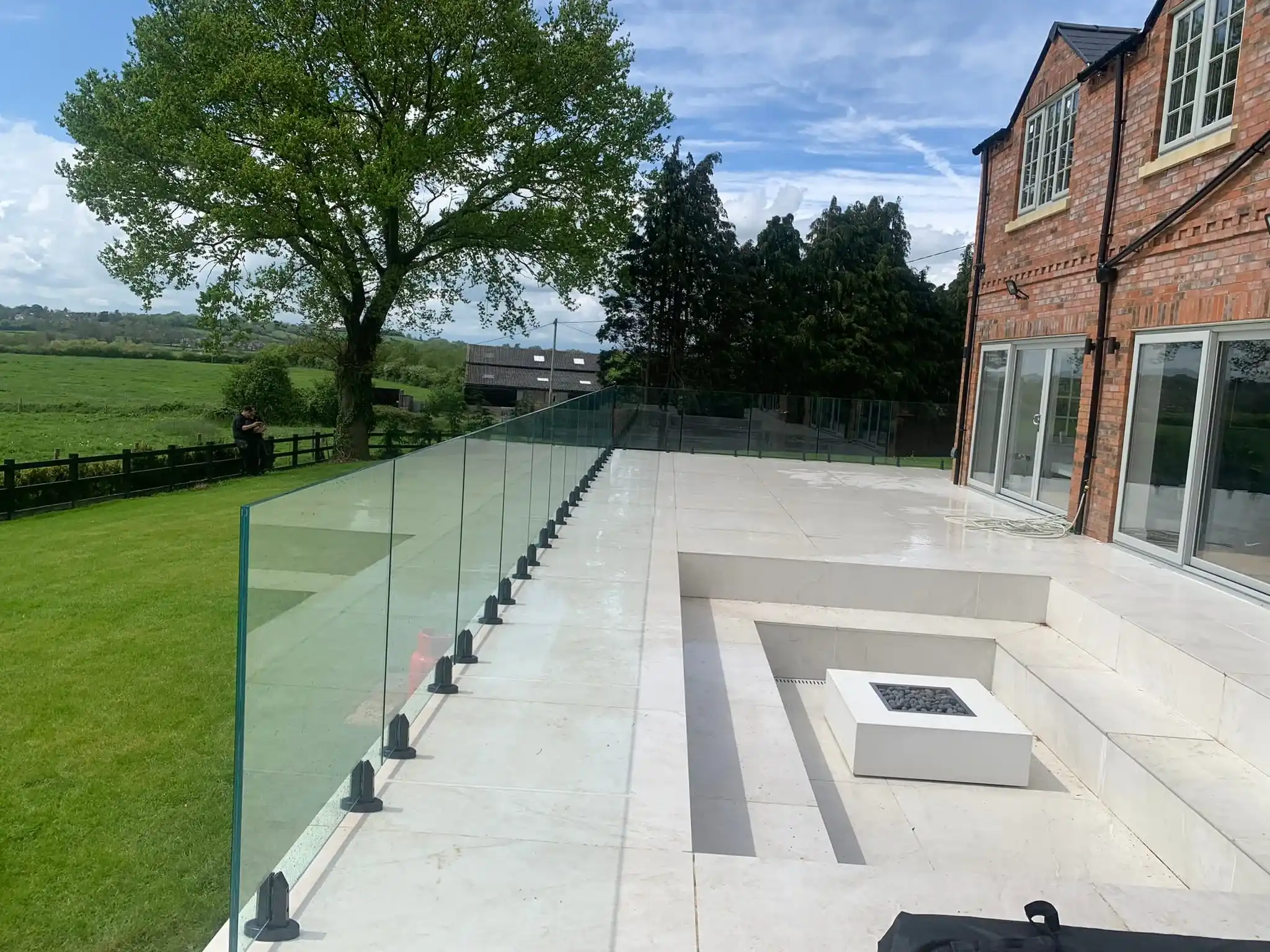 Outdoor terrace glass balustrade with minimal visible hardware