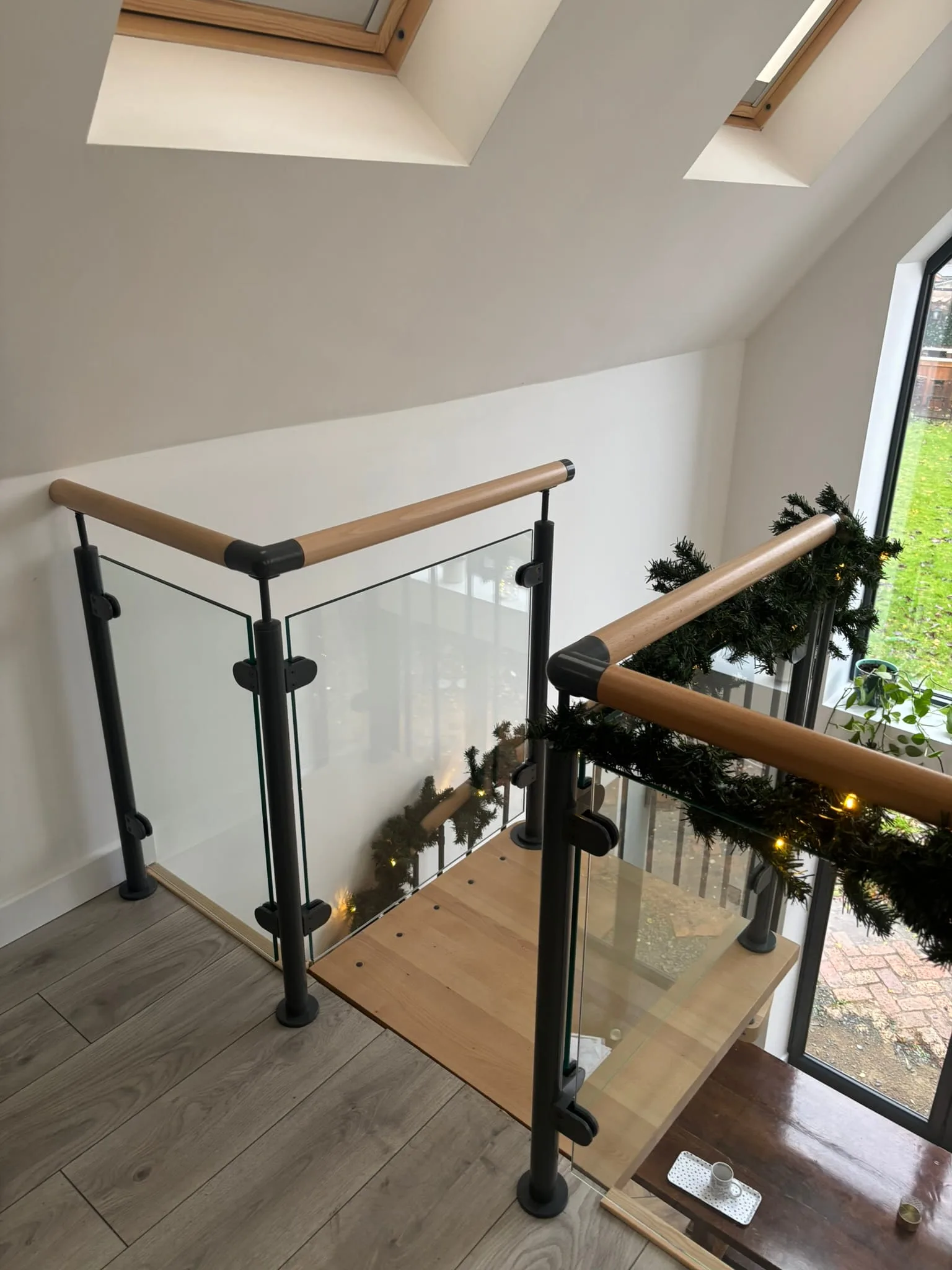 Steel spiral staircase with powder-coated handrail and toughened glass panel balustrade, Bingham
