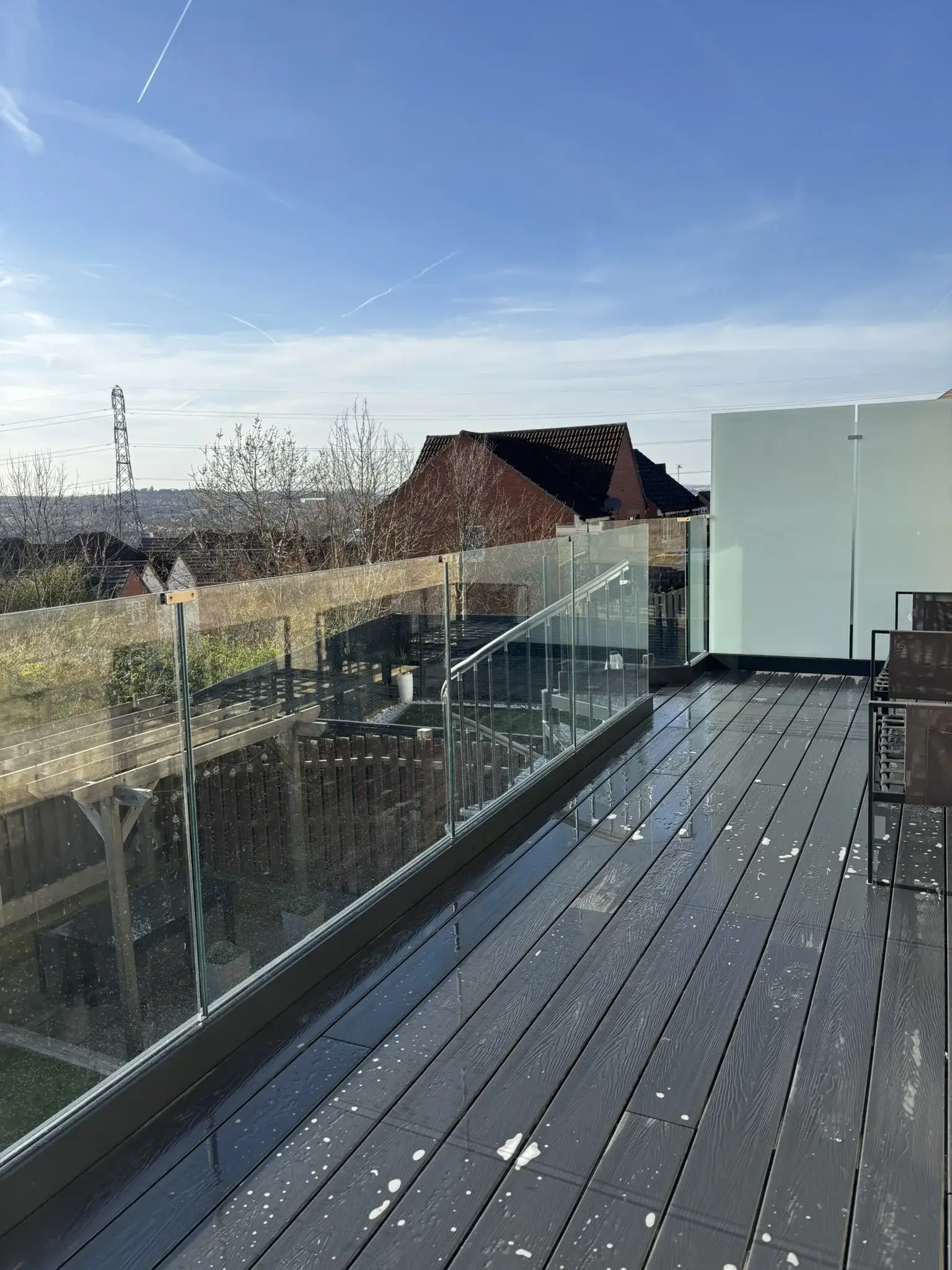 Galvanised spiral staircase providing access to raised balcony