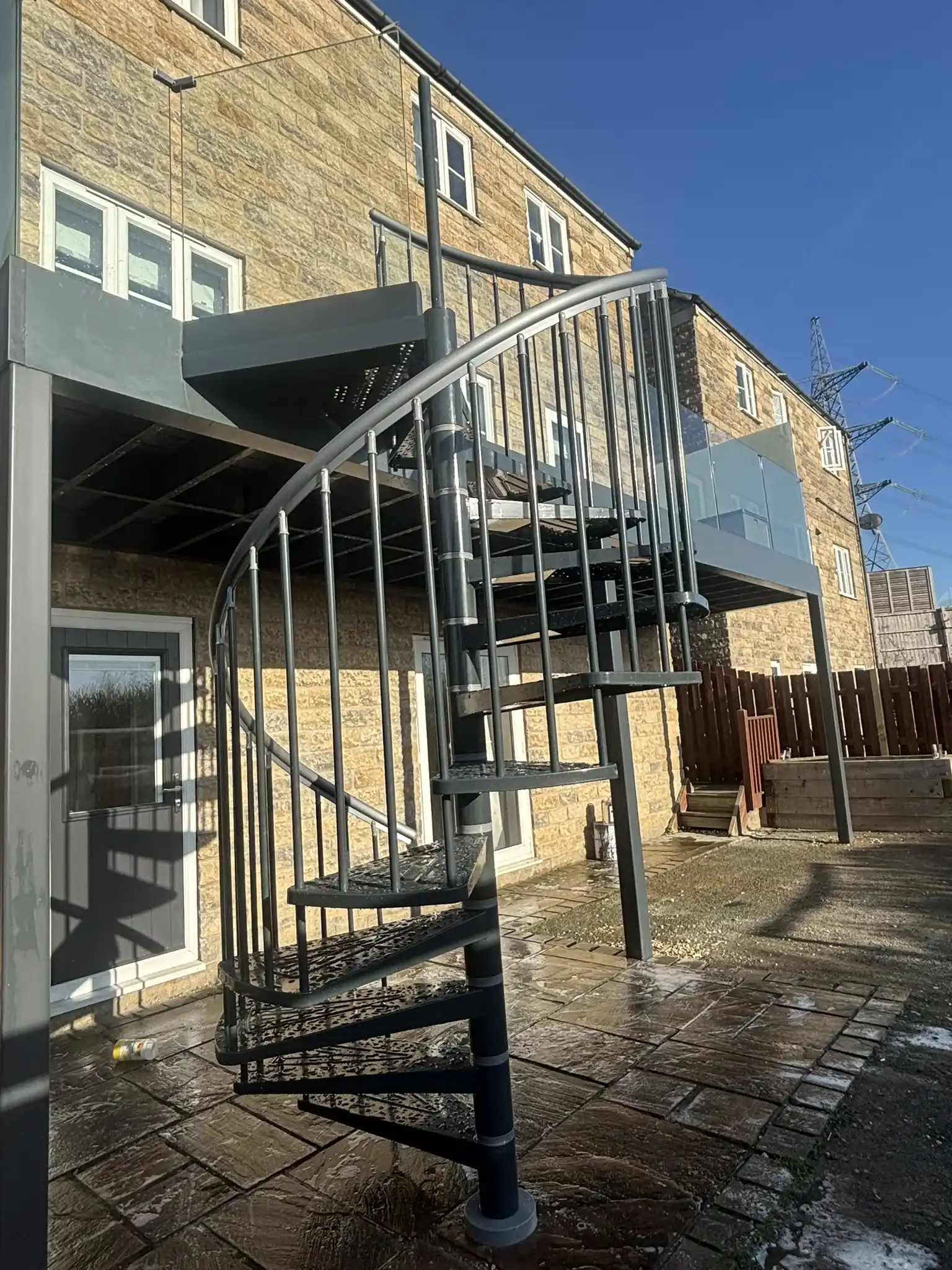 Galvanised steel posts fixed into concrete footings
