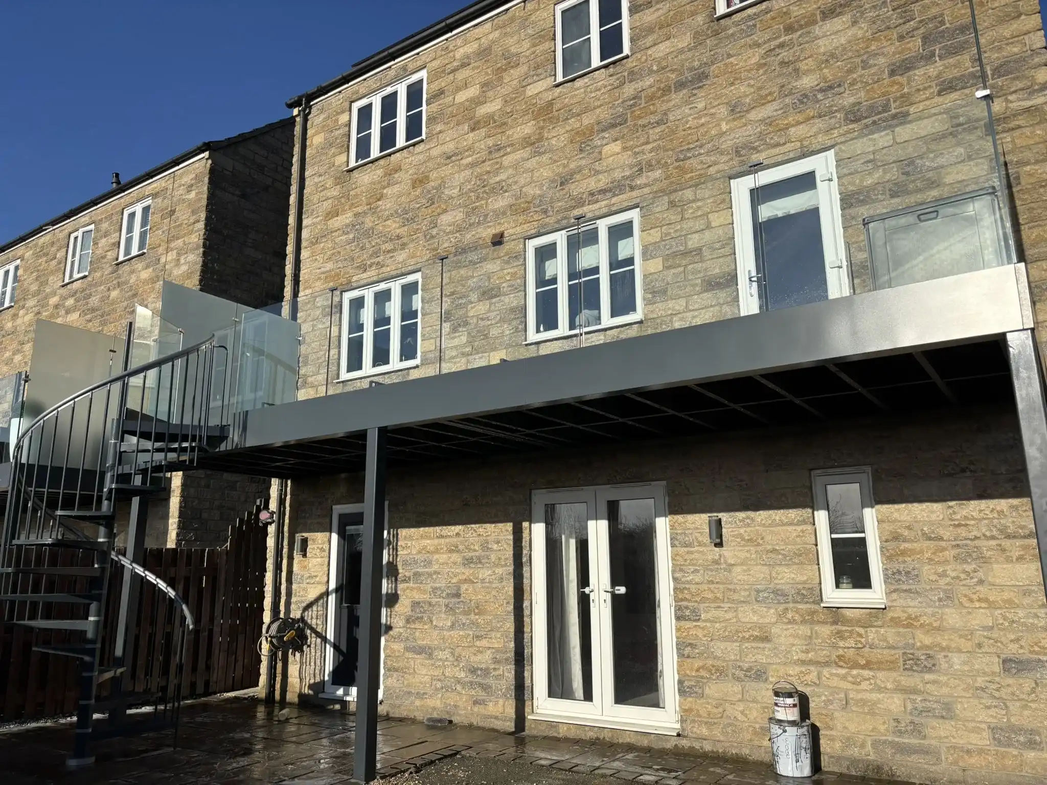Steel staircase and balcony combination for multi-level access