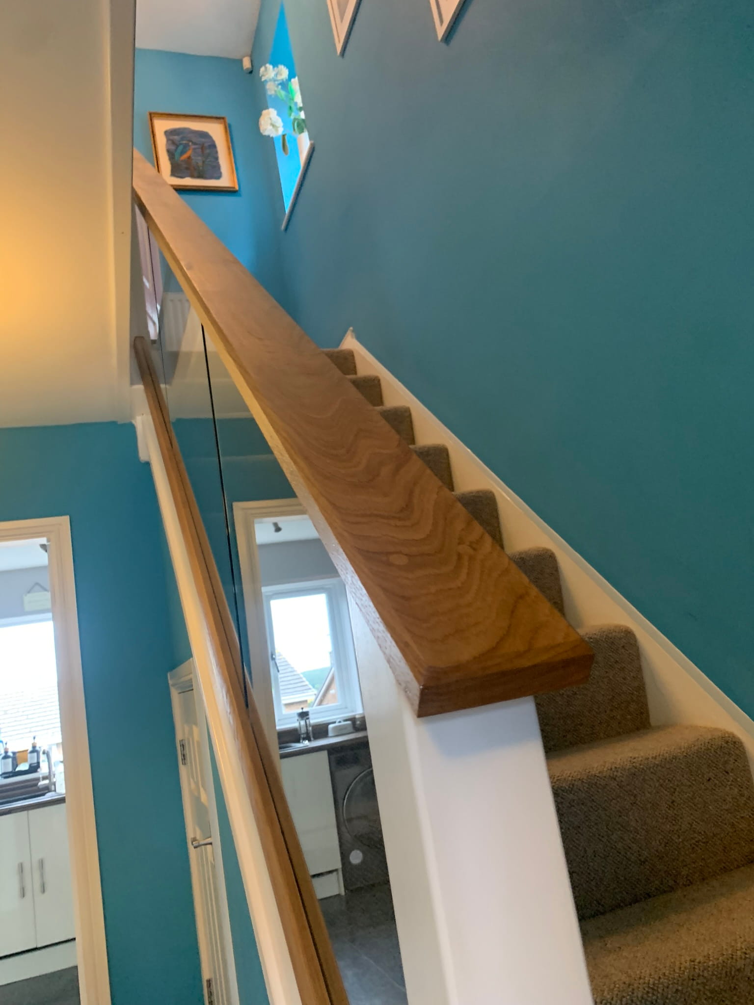 White square newel posts and oak baserail with glass panel infill, Derby