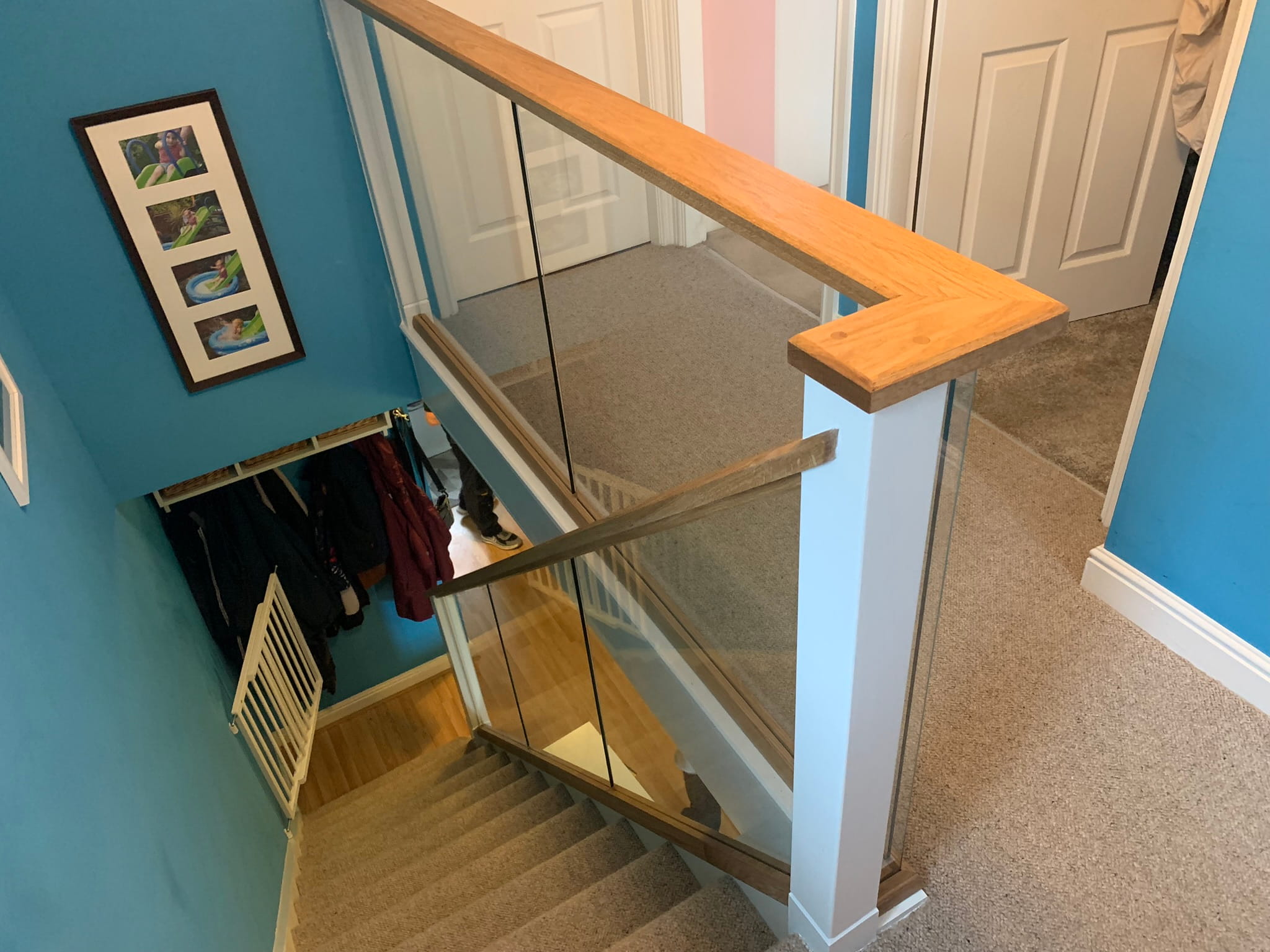 Full view of completed white and oak glass staircase renovation, Derby